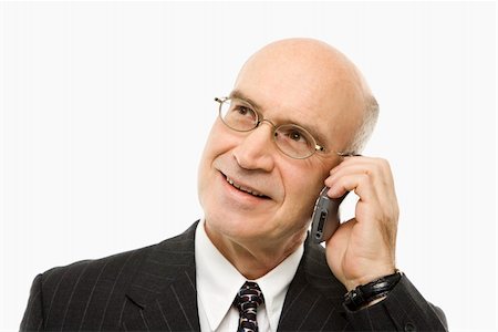 simsearch:400-03926822,k - Caucasian middle-aged businessman talking on cellphone smiling against white background. Stock Photo - Budget Royalty-Free & Subscription, Code: 400-03924318