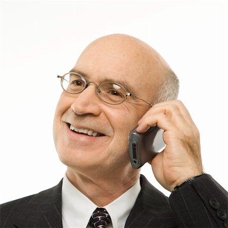 simsearch:400-03926822,k - Caucasian middle-aged businessman talking on cellphone smiling against white background. Stock Photo - Budget Royalty-Free & Subscription, Code: 400-03924319