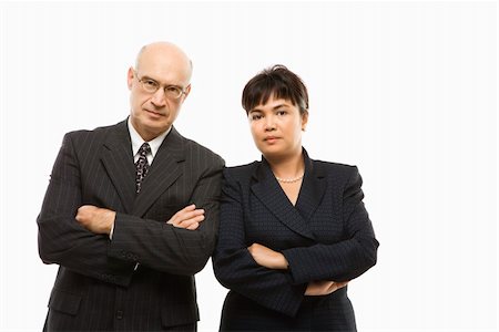 filipina businesswoman - Caucasian middle-aged businessman and Filipino businesswoman standing  with arms crossed against white background. Stock Photo - Budget Royalty-Free & Subscription, Code: 400-03924348