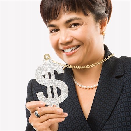 filipina businesswoman - Smiling Filipino middle-aged businesswoman wearing chain necklace with oversized dollar sign. Stock Photo - Budget Royalty-Free & Subscription, Code: 400-03924355
