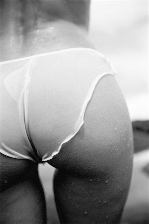 simsearch:400-04956678,k - Back view of sexy Caucasian woman's rear in sheer panties walking on beach in Maui, Hawaii. Foto de stock - Super Valor sin royalties y Suscripción, Código: 400-03924815