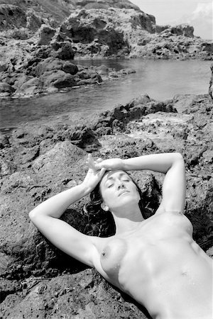 simsearch:400-03940673,k - Sexy nude Caucasian woman lying on back with eyes closed on beach in Maui, Hawaii. Stock Photo - Budget Royalty-Free & Subscription, Code: 400-03924817