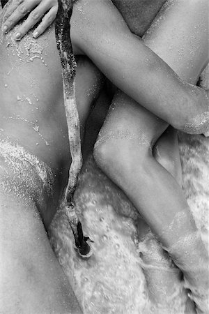 simsearch:400-03940673,k - Nude young couple embracing in water on beach in Maui, Hawaii. Stock Photo - Budget Royalty-Free & Subscription, Code: 400-03924962