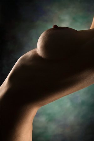 Side view of nude Caucasian female body arching backwards. Photographie de stock - Aubaine LD & Abonnement, Code: 400-03925003