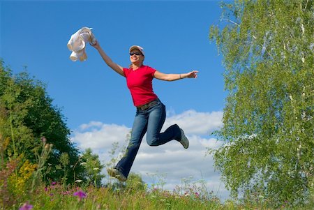 simsearch:400-04215852,k - Beautiful lady jumping in summer landscape Stock Photo - Budget Royalty-Free & Subscription, Code: 400-03925035
