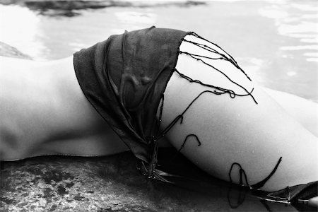 simsearch:400-04955255,k - Leg and hip of mid adult Caucasian female lying in water wearing shawl at Maui coast. Stockbilder - Microstock & Abonnement, Bildnummer: 400-03925142