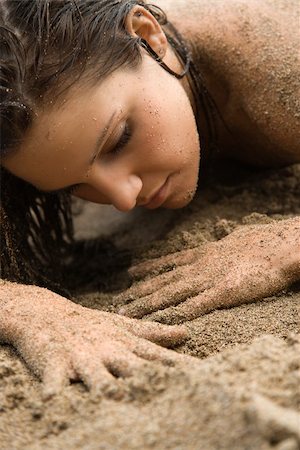 simsearch:400-04450908,k - Head shot of Caucasian young adult nude woman lying in sand. Stock Photo - Budget Royalty-Free & Subscription, Code: 400-03925241