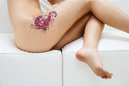 simsearch:400-04186416,k - Portrait of nude attractive redhead Caucasian young woman with tattoo. Stockbilder - Microstock & Abonnement, Bildnummer: 400-03925296