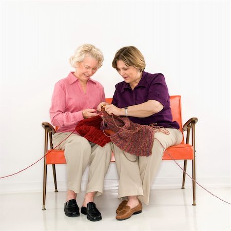 Caucasian middle aged woman and senior woman sitting and knitting. Stock Photo - Budget Royalty-Free & Subscription, Code: 400-03925642