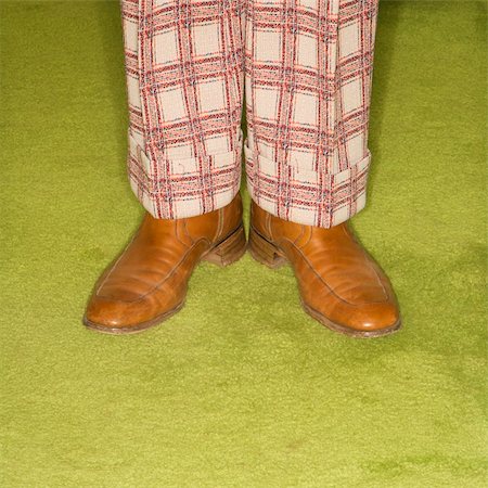 simsearch:400-04451365,k - Close-up of Caucasian male legs in plaid pants standing on green retro carpet. Foto de stock - Super Valor sin royalties y Suscripción, Código: 400-03925743