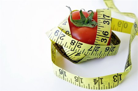 physical fit food - Tomato with measuring tape Stock Photo - Budget Royalty-Free & Subscription, Code: 400-03925809