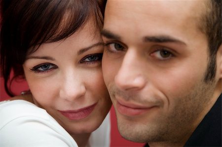 simsearch:400-03942507,k - portrait of a young couple kissing each other Fotografie stock - Microstock e Abbonamento, Codice: 400-03925838