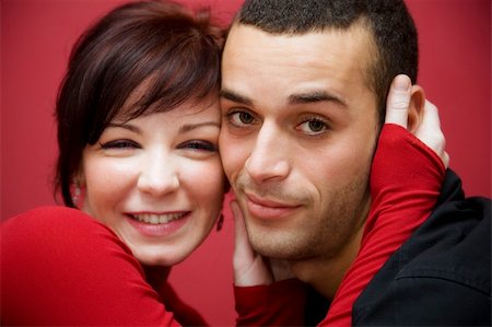 simsearch:400-03942507,k - portrait of a young couple kissing each other Fotografie stock - Microstock e Abbonamento, Codice: 400-03925843