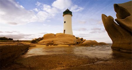 simsearch:400-04515946,k - lighthouse seen from a tiny beach in Sardinia. Foto de stock - Super Valor sin royalties y Suscripción, Código: 400-03925852
