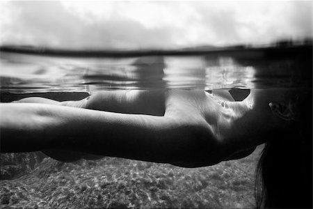 simsearch:400-04955255,k - Underwater view of young Asian nude woman floating on back. Stockbilder - Microstock & Abonnement, Bildnummer: 400-03925915
