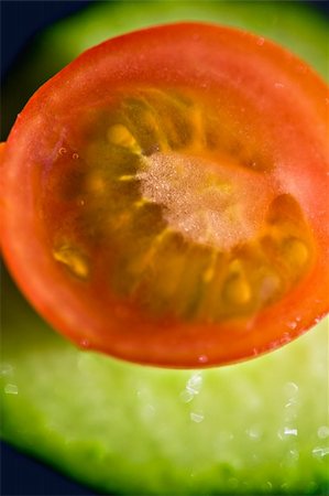 Cherry tomatoes on a slice of cucumber, abstract series Stock Photo - Budget Royalty-Free & Subscription, Code: 400-03925984