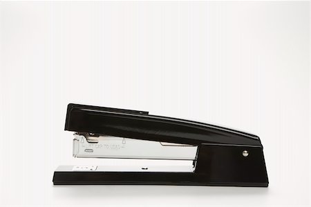 simsearch:400-03926032,k - Side view of black stapler on white background. Stock Photo - Budget Royalty-Free & Subscription, Code: 400-03926027