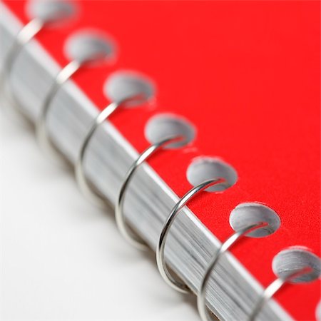 simsearch:400-03926061,k - Close up red spiral bound notebook. Foto de stock - Royalty-Free Super Valor e Assinatura, Número: 400-03926055