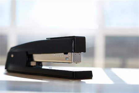 simsearch:400-03926032,k - Black stapler with window in background. Stock Photo - Budget Royalty-Free & Subscription, Code: 400-03926067