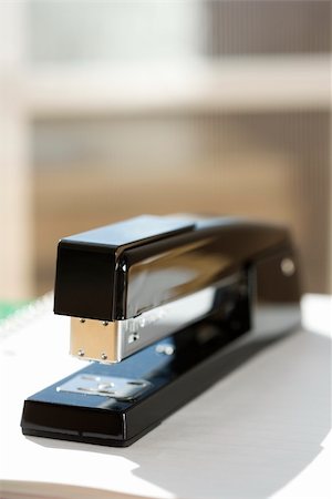 simsearch:400-03926032,k - Black stapler with window in background. Stock Photo - Budget Royalty-Free & Subscription, Code: 400-03926068