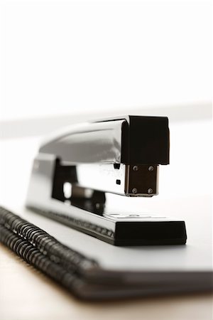 simsearch:400-03926032,k - Black stapler on top of a spiral bound notebook. Stock Photo - Budget Royalty-Free & Subscription, Code: 400-03926070