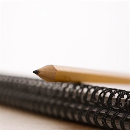 simsearch:400-03926061,k - Close up of pencil on top of spiral bound notebook. Foto de stock - Royalty-Free Super Valor e Assinatura, Número: 400-03926073