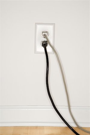 simsearch:700-00158286,k - Two cords plugged into electrical wall outlet. Foto de stock - Super Valor sin royalties y Suscripción, Código: 400-03926105