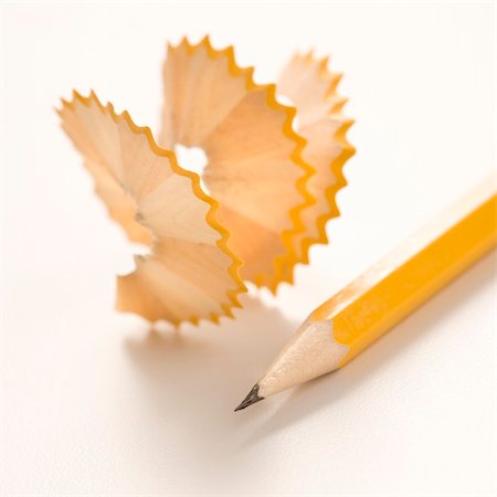 Sharp pencil next to spiral pencil shavings. Stockbilder - Microstock & Abonnement, Bildnummer: 400-03926133