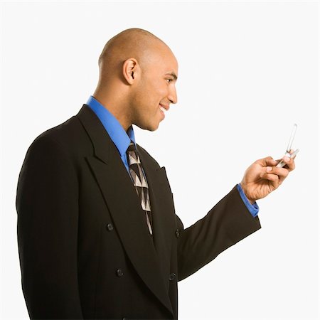 simsearch:400-03926822,k - African American man smiling and using cellphone. Stock Photo - Budget Royalty-Free & Subscription, Code: 400-03926217