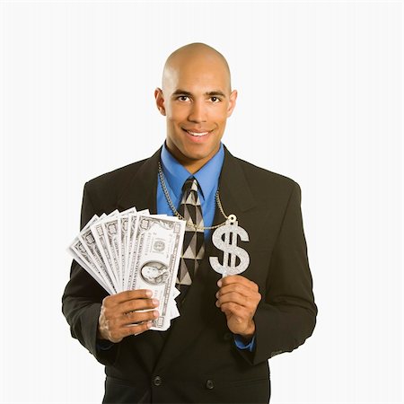 African American man in suit wearing necklace with money sign and holding cash. Stock Photo - Budget Royalty-Free & Subscription, Code: 400-03926219