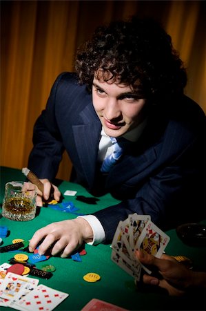 A stroke of luck playing poker. The guy cleaned all out Stock Photo - Budget Royalty-Free & Subscription, Code: 400-03926335