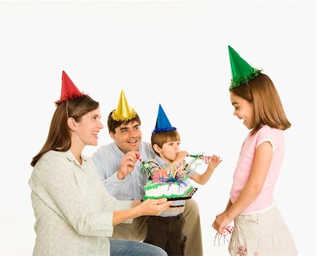 simsearch:400-04452450,k - Family celebrating girl's birthday with cake. Stock Photo - Budget Royalty-Free & Subscription, Code: 400-03926443