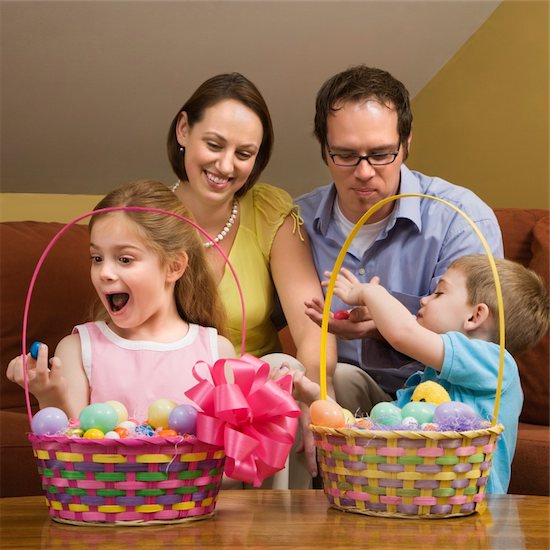 Caucasian family with looking at Easter baskets. Stock Photo - Royalty-Free, Artist: iofoto, Image code: 400-03926577