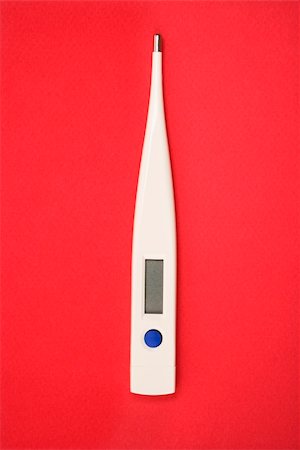 Digital thermometer on red background. Fotografie stock - Microstock e Abbonamento, Codice: 400-03926946