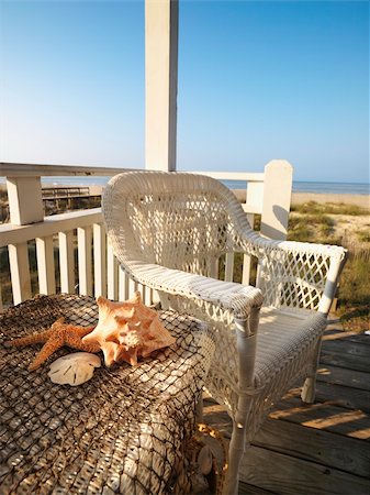 starfish beach nobody - Still life shot of a wicker chair and sea shells on table with beach in background. Stock Photo - Budget Royalty-Free & Subscription, Code: 400-03926963