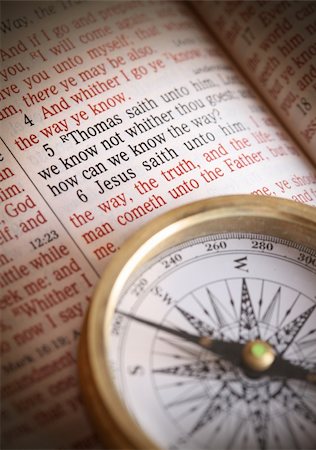 Compass and bible depicting popular bible verse John 14:5-6  How do we know the way.  I am the way the truth and the life....etc.   Focus to bible text Foto de stock - Super Valor sin royalties y Suscripción, Código: 400-03927260
