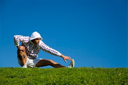 simsearch:400-03927272,k - healthy lifestyle: man doing stretching in a park Stock Photo - Budget Royalty-Free & Subscription, Code: 400-03927662