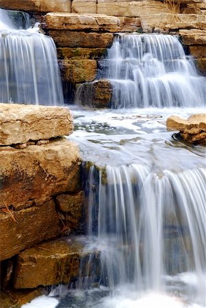 simsearch:400-05059020,k - Beautiful cascading waterfall over natural rocks, landscaping element Stock Photo - Budget Royalty-Free & Subscription, Code: 400-03927776