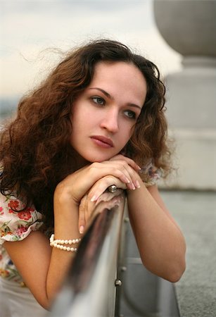 simsearch:400-04479015,k - Portrait of the thoughtful girl on a roof of a house Stock Photo - Budget Royalty-Free & Subscription, Code: 400-03928136