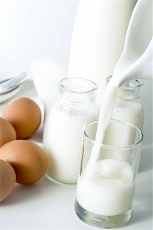 eggs milk - Milk pouring from jug Stock Photo - Budget Royalty-Free & Subscription, Code: 400-03928210