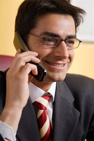 simsearch:400-03985399,k - friendly businessman talking on the phone and smiling Foto de stock - Royalty-Free Super Valor e Assinatura, Número: 400-03928223