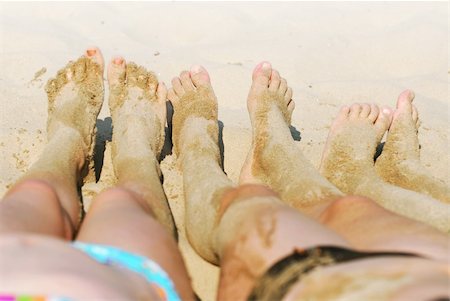 Row of children's feet on a beach covered in sand Stock Photo - Budget Royalty-Free & Subscription, Code: 400-03928426