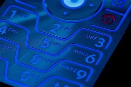 short circuit - A closeup of a cell phones illuminated key pad and numbers Photographie de stock - Aubaine LD & Abonnement, Code: 400-03928442