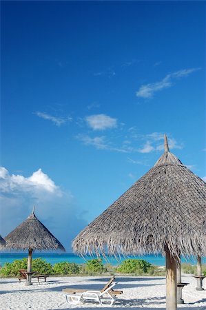 simsearch:400-03984857,k - tropical beach on the maldives with canvas chairs and sunshades Foto de stock - Super Valor sin royalties y Suscripción, Código: 400-03928460