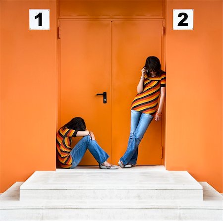 depressed woman in the street - Loneliness woman and the other talking at the phone Stock Photo - Budget Royalty-Free & Subscription, Code: 400-03928593