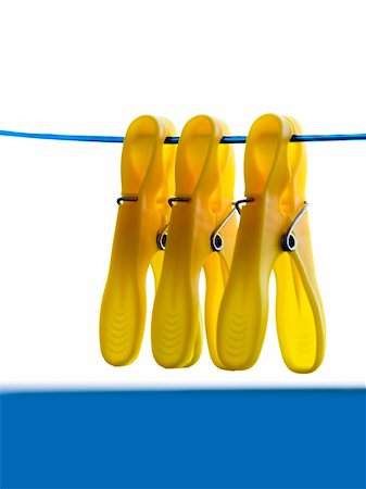 simsearch:700-01787514,k - Three clothes yellow clip on blue rope. Stock Photo - Budget Royalty-Free & Subscription, Code: 400-03928947