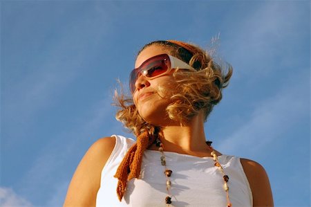 Young girl wearing sunglasses at sunset Stock Photo - Budget Royalty-Free & Subscription, Code: 400-03929059