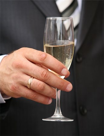 simsearch:400-03929021,k - Glass of champagne in a hand of the groom Stock Photo - Budget Royalty-Free & Subscription, Code: 400-03929151