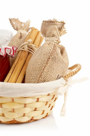 simsearch:649-07064984,k - Burlap sac, jam jar and sticks cinnamon in a basket reflected on white background Foto de stock - Super Valor sin royalties y Suscripción, Código: 400-03929304