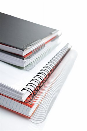 simsearch:400-03914073,k - Some notebooks with soft shadow on white background. Shallow DOF Photographie de stock - Aubaine LD & Abonnement, Code: 400-03929316